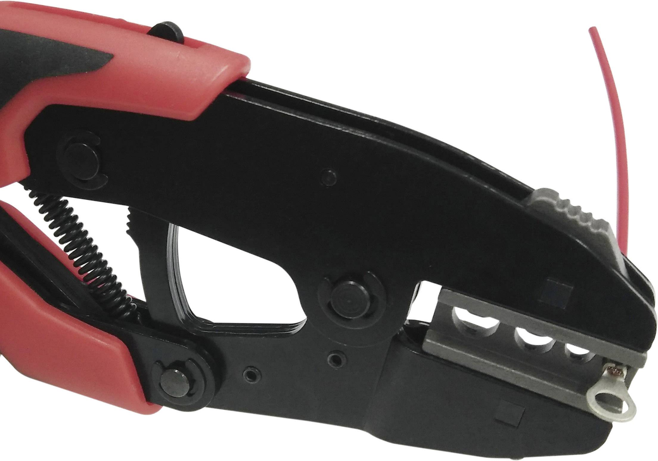 Black and red wire stripping pliers cutting a red cable. Tool for stripping cables in electrical applications.
