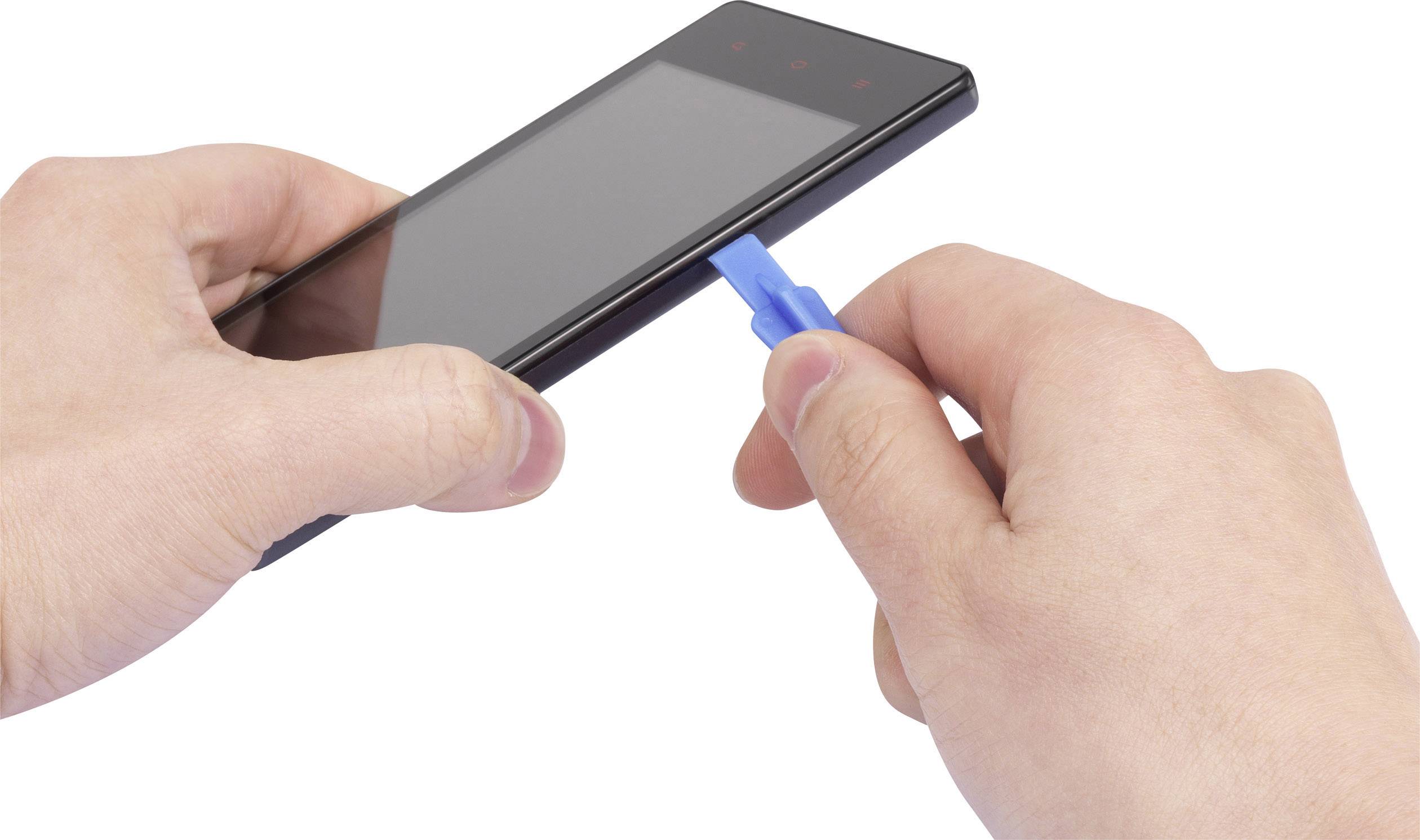 A person is using a tool to remove or insert a SIM card from a smartphone. Hands are holding the phone and the tool.