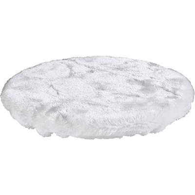 A round, fluffy, white rug lies flat on the floor.