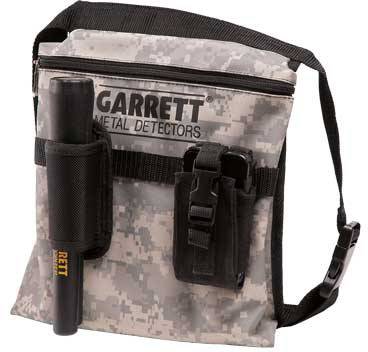 'Camouflage-coloured detector pouch with belt, printed logo and two holders; one holder contains a detector device.'