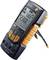 Digital multimeter with display, showing 230.0 V at 50.0 Hz AC. It features buttons for settings such as 'AUTO', 'HOLD' and more.