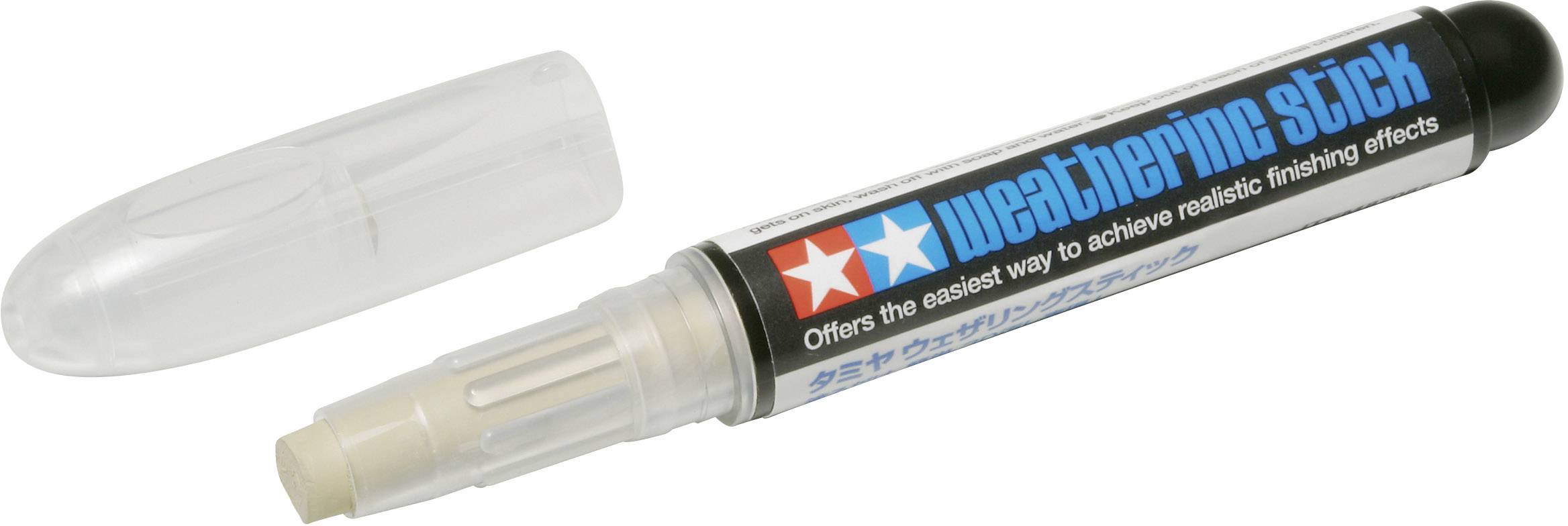 A black weathering pencil with the cap removed, used to achieve realistic ageing effects on models and surfaces.