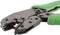 Green metal crimping pliers shown from the side, used for pressing cable connections.