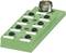 A green terminal block with multiple screw terminals for electrical connections. At the top, there is a round, metallic connector.
