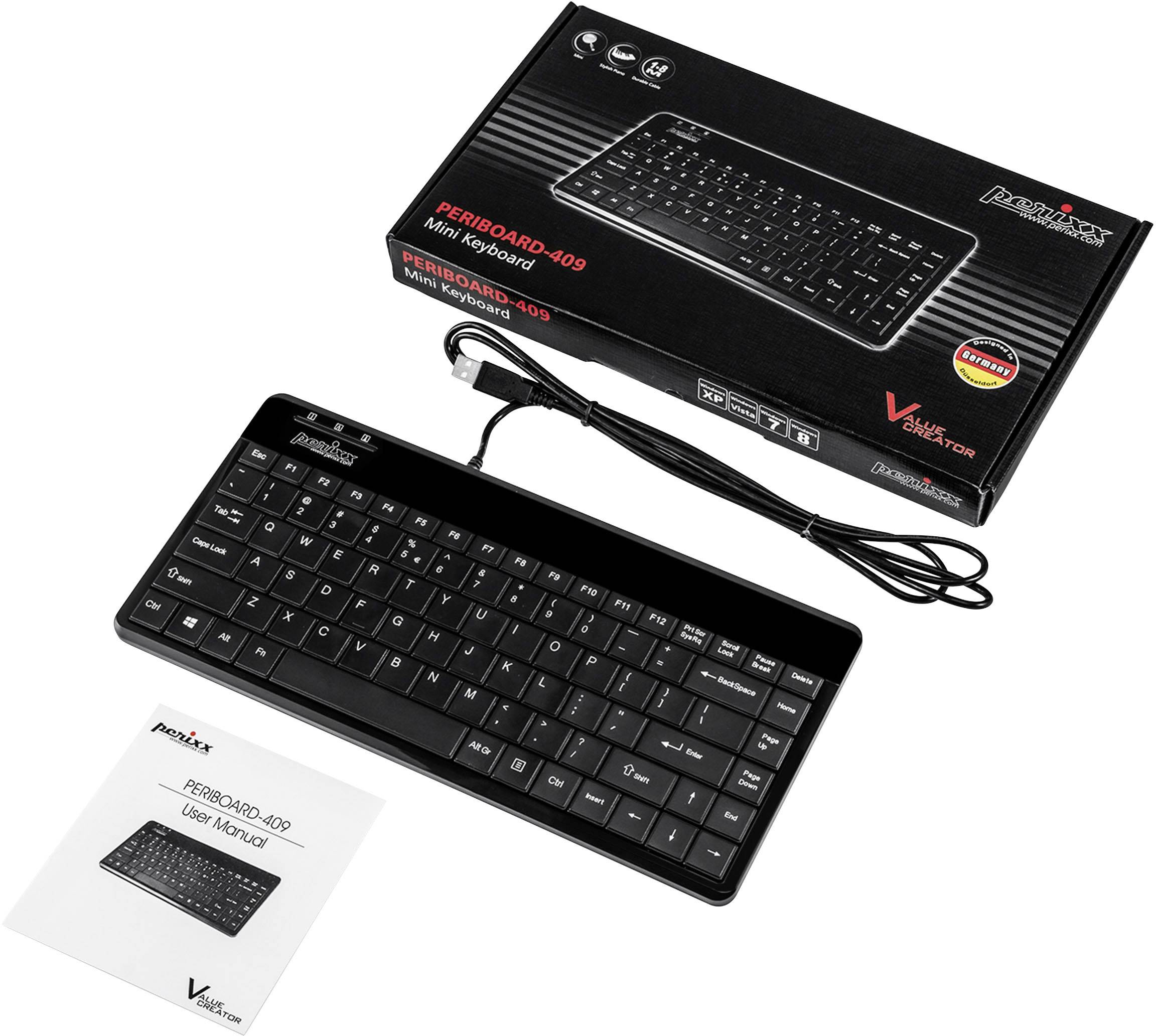 Keyboard set comprising a black, compact USB keyboard and an instruction manual. Packaging in the background.