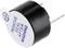 Small round electronic component with the inscription 'Remove seal after washing'. Two pins protrude for mounting.