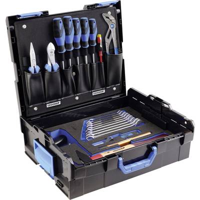 An open toolbox with screwdrivers, pliers and a set of spanners, all neatly arranged in compartments.