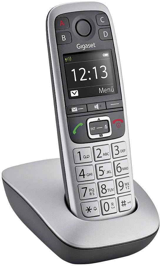 Cordless telephone on the charging station, time display '12:13'. Large keypad with alphanumeric keys and call function buttons.