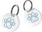 Two white pet tags with blue paw print symbol, each with a metal ring.