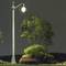 Street lamp illuminates an empty park with a bench and trees at night.