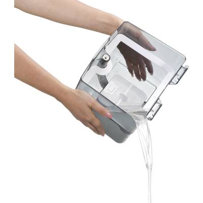 A person is holding a transparent water container, pouring water from a small opening.