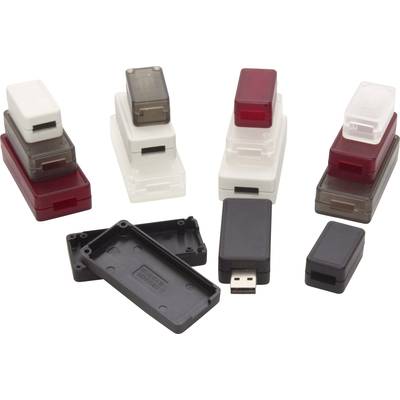 Several plastic casings, some open, alongside a USB stick with its casing removed, display various styles and colours.
