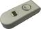 A white switch with a round button set to 'O', with a small rectangular indicator beside it.