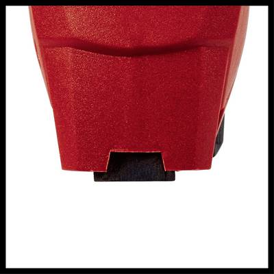 'Close-up of a red plastic casing with symmetrical edges and a small opening at the bottom.'
