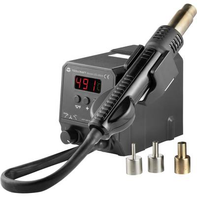 Hot air soldering station with digital temperature display, set to 491 degrees. Three different nozzle attachments are lying beside it.