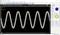 Screenshot of an oscilloscope with a sinusoidal waveform. The display shows measurements of 5.7 V and 8.2 V.