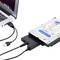 An external hard drive is connected to a laptop via a USB cable.