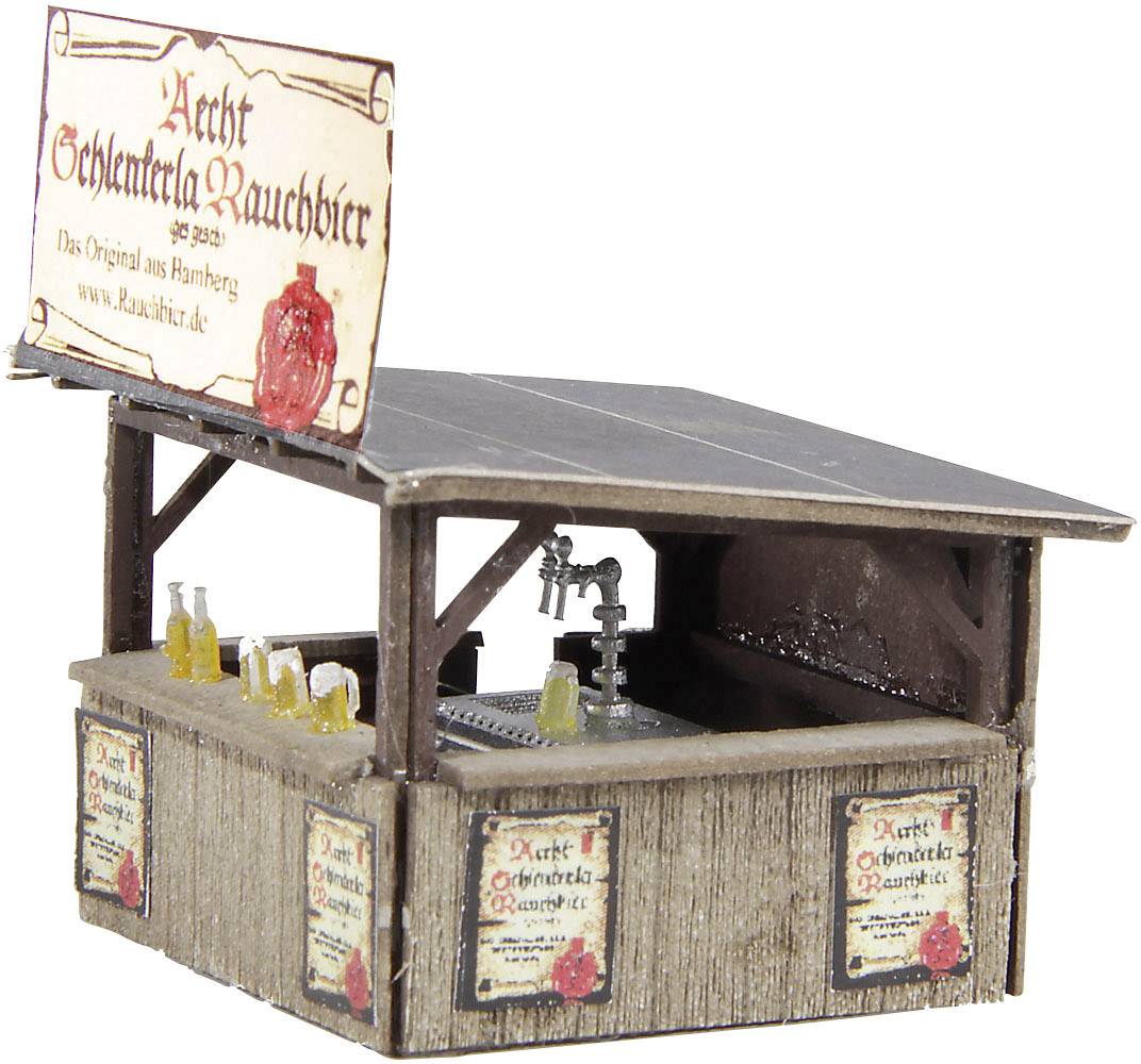 'Small sales kiosk with wood-effect panelling, beer bottles and a draught tap. Sign: Aecht Schlenkerla Rauchbier, Original from Bamberg.'