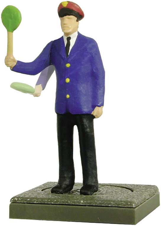A small figurine of a railway employee wearing a red cap and blue uniform, holding a signal in his hand.