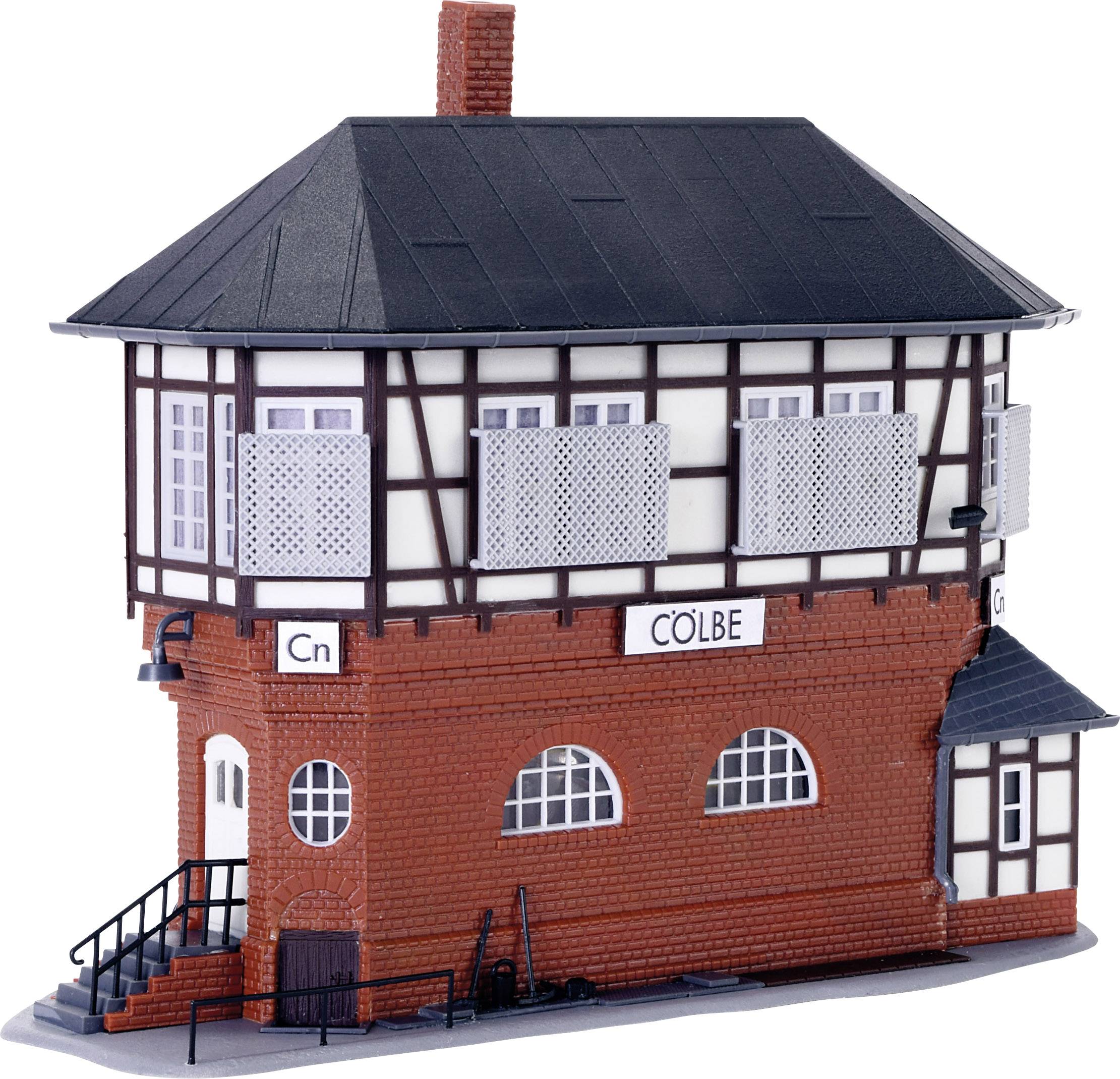 Model railway house in half-timbered style with red bricks. It bears the inscription 'Cölbe' and has a black roof and steps.