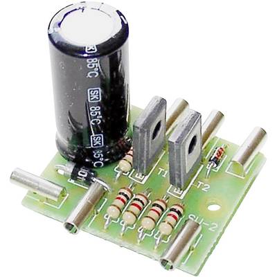 Electronic circuit board with capacitor, transistors and resistors. Components arranged on green printed circuit board for circuit assembly.