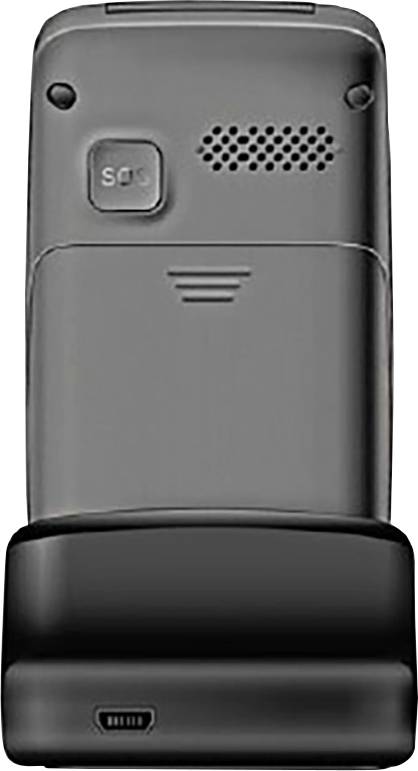 Back of a grey mobile phone, showing SOS button and speaker grille, placed on a charging station.