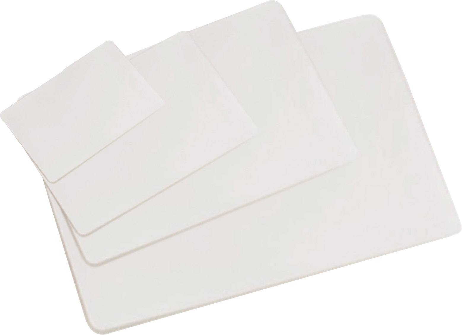 Four white, rectangular silicone mats of different sizes are layered on top of each other. They are flexible and smooth.
