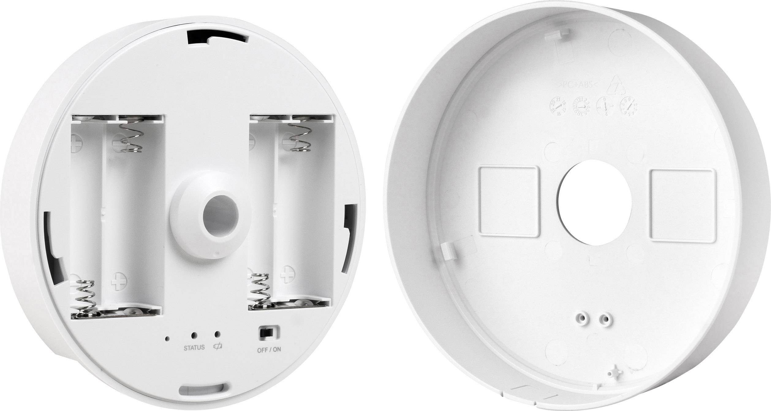 Two round white battery compartments without batteries, one compartment showing spring contacts and a switch marked with 'ON/OFF'.