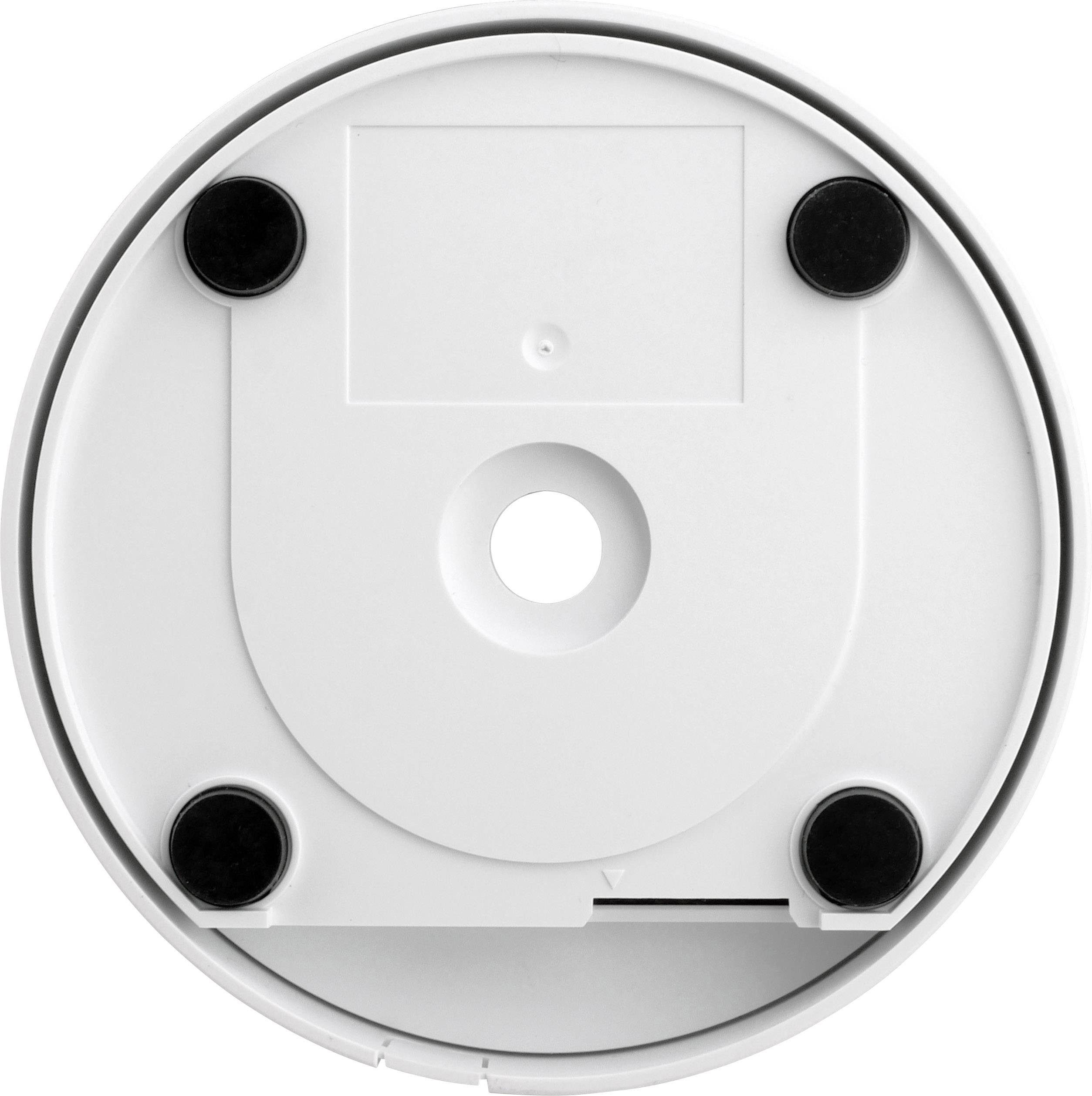 Back view of a white, round device with five black rubber feet, a central hole, and a square recess in the middle.
