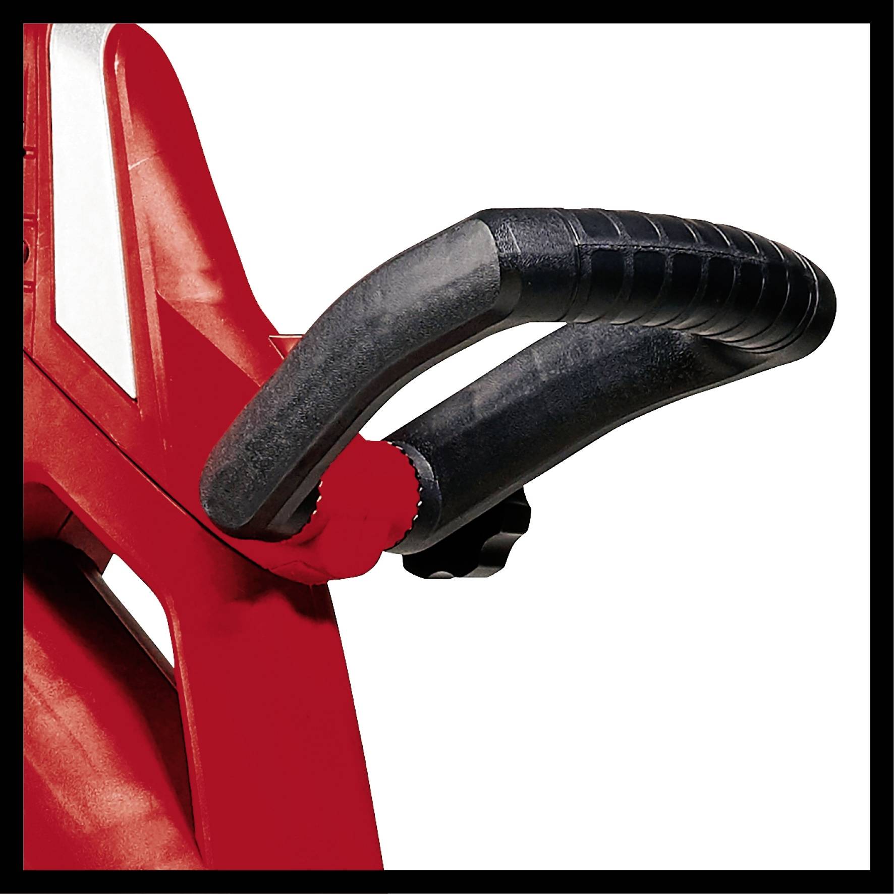 Close-up of a black, textured handle on a red device, possibly part of a tool or machine.