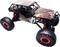 A remote-controlled off-road toy car with large, rugged tyres and a colourful, sporty design.