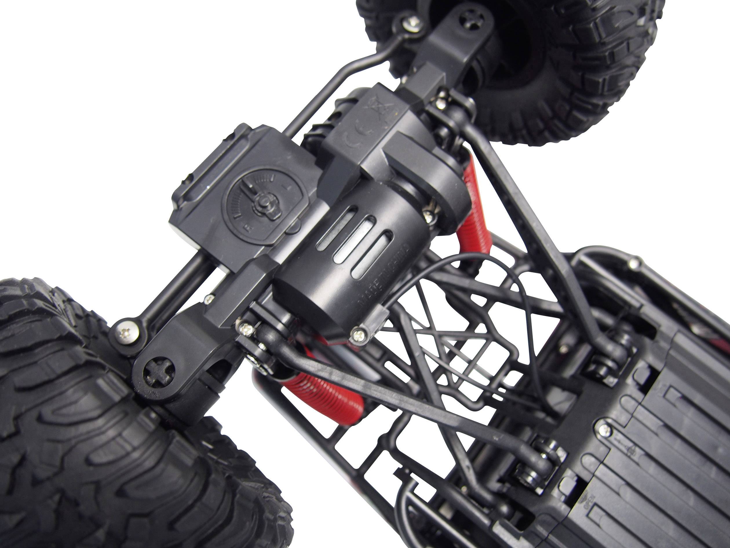 Close-up of a remote-controlled truck chassis with robust tyres and suspension. Primary objective: Off-road capability and stability.