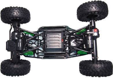 Remote-controlled car viewed from underneath, showing large off-road tyres and suspension designed for rough terrain.
