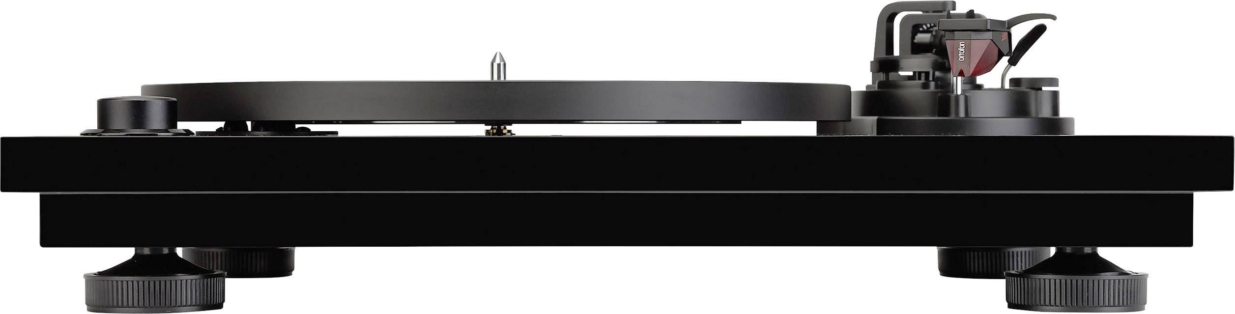 Black record player viewed from the side, with a tonearm and cartridge on the right side.