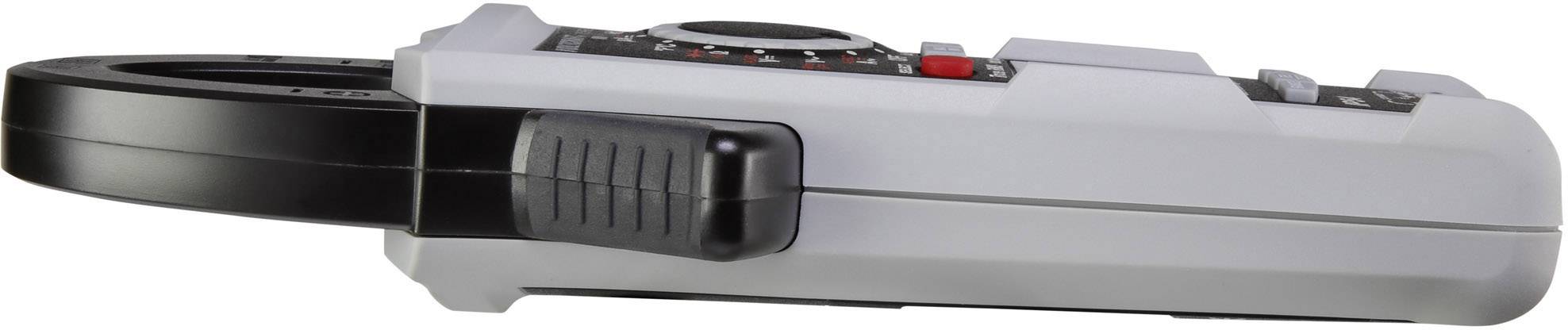 A digital multimeter viewed from the side, predominantly grey with black and red details, shows the measuring device from its lateral perspective.