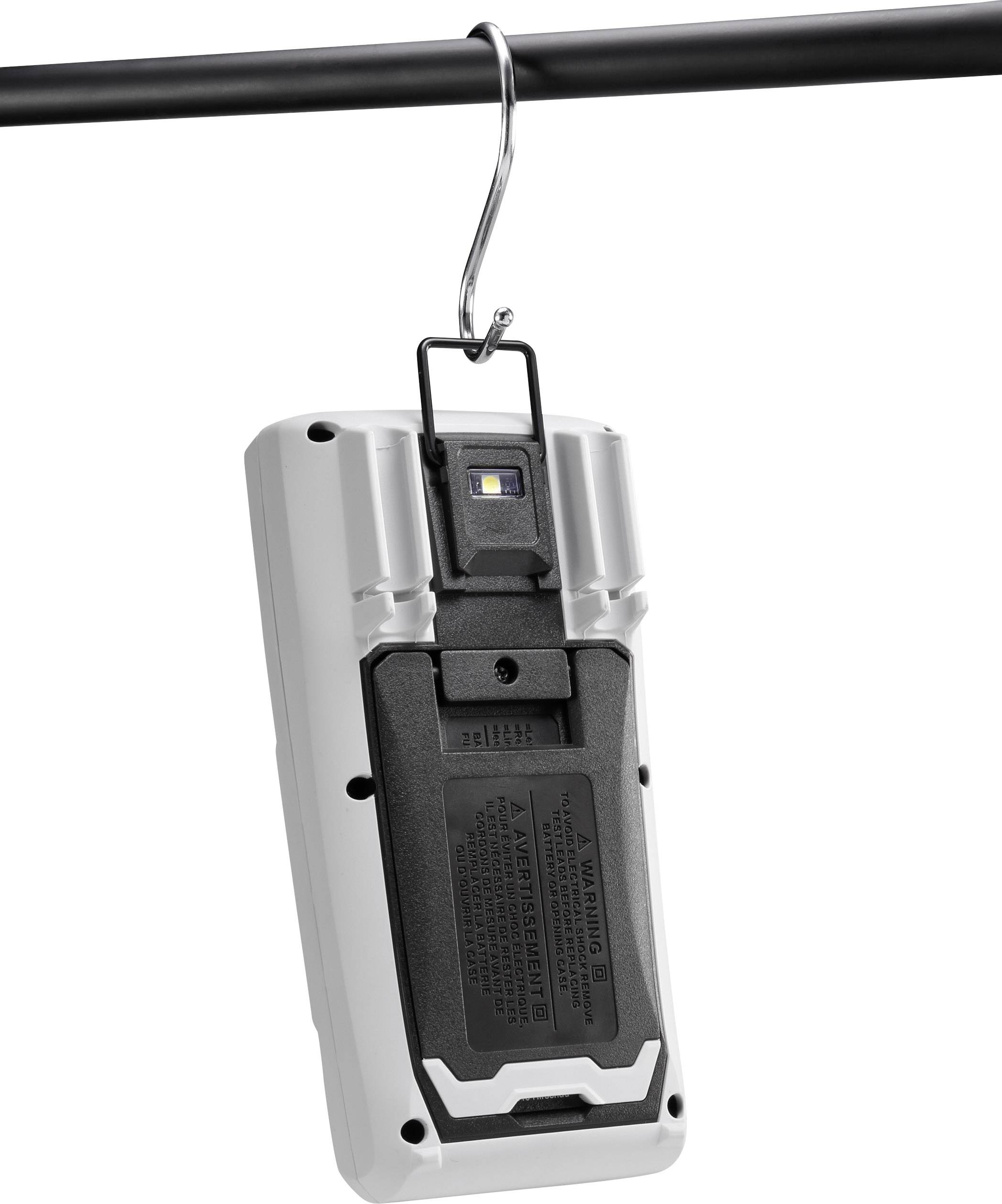 A portable device hanging from a pole by a hook. Rear view shows an LED light and a black cover.