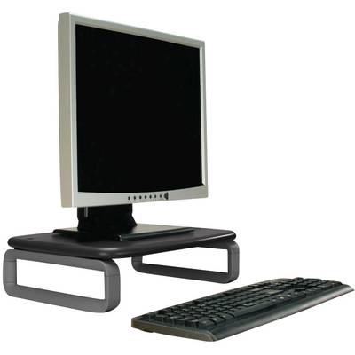A computer monitor on a monitor stand with a keyboard in front of it.
