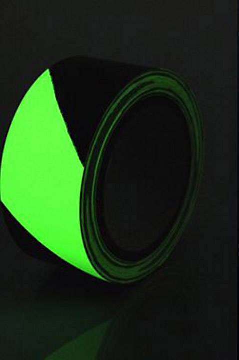 Luminous green adhesive tape that glows in the dark, serving safety or decorative purposes.