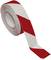 A roll of barrier tape with red and white stripes, commonly used to cordon off construction sites or restricted areas.