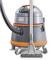 A grey and orange industrial vacuum cleaner on wheels with a long hose and a wide nozzle, suitable for large areas.