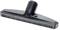 Suction foot for vacuum cleaner with black bristles and grey plastic body, designed for effective cleaning of smooth floors.