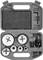 A grey tool case with drill crowns in various sizes and an Allen key, embedded in black foam.