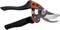 Metal shears with a black and orange handle, open, on a white background. Suitable for cutting branches.
