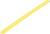 A plain, yellow candle without decoration lies horizontally.