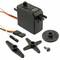 A black servo motor with cables, multiple plastic gears in various shapes, and a small screw.