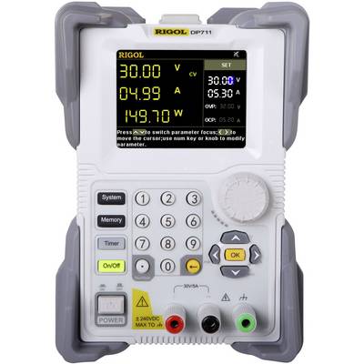 A Rigol DP711 power supply displays voltage and current values on a digital display. Buttons allow settings and adjustments.