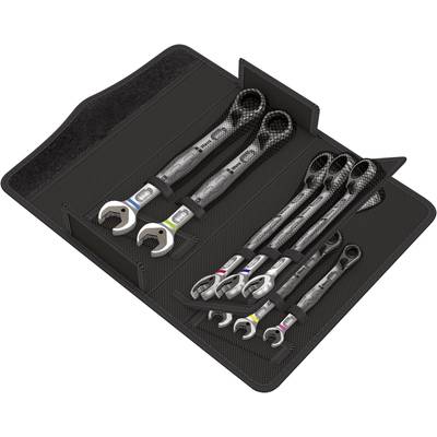 A set of open-ended ring spanners laid out on a black tool mat in various sizes.