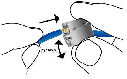 'Two hands press the clip of a network cable connector before disconnecting the cable.'