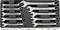 Set of nine silver spanners in various sizes, stored in a black case. Spanners arranged in rows.