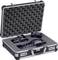An open aluminium case with foam, with three professional camera lenses carefully positioned inside.
